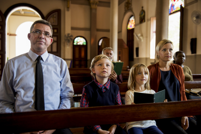 family praying in the church